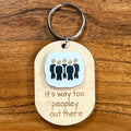 It's Way Too Peopley Out There laser-engraved maple wood keychain with white/black acrylic crowd silhouette detail