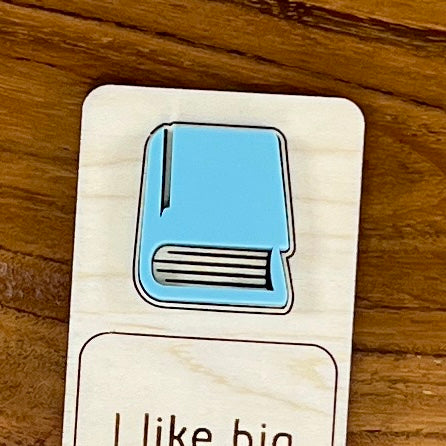 Close-up of laser-engraved detail on eucalyptus acrylic book of I Like Big Books birch bookmark