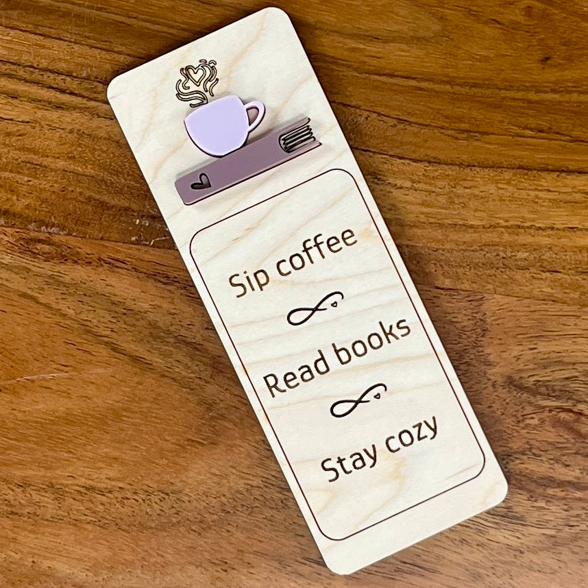 Sip Coffee Read Books Stay Cozy birch wood bookmark with ash rose acrylic coffee cup on mauve book
