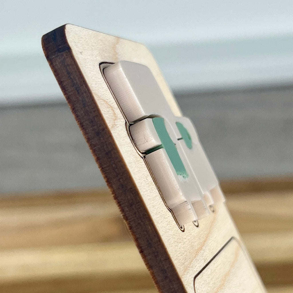 Side view of Introverting with Books birch bookmark showing dimensional acrylic layers