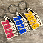 Class of 2026 laser-engraved maple graduation keychains with acrylic grad cap and watermelon, blue and mango numeral variants