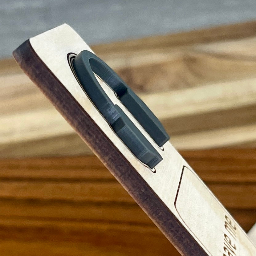 Side view of Leave Me Alone I'm Reading birch bookmark showing dimensional acrylic layers