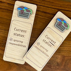Current Status Ignoring Responsibilities birch wood bookmark with overflowing acrylic laundry basket