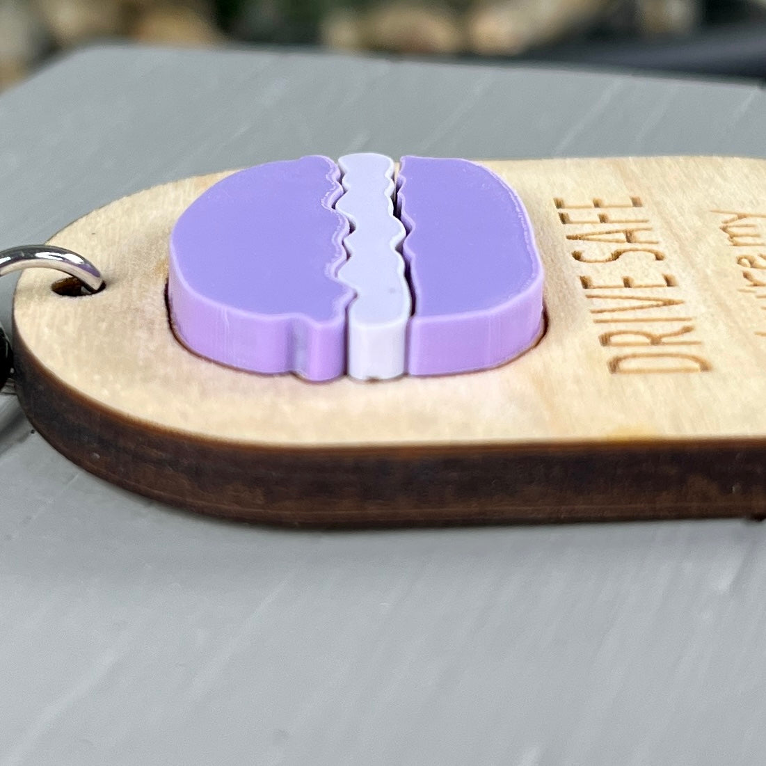 Drive Safe Favourite Cookie wood keychain showing engraved text and macaron detail