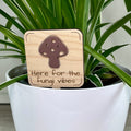 Here for the Fungi Vibes maple wood plant stake with mauve acrylic mushroom in a white pot