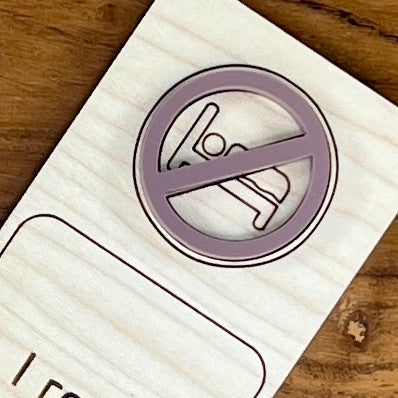 Close-up of mauve acrylic no-sleep symbol on I Read Past My Bedtime birch bookmark