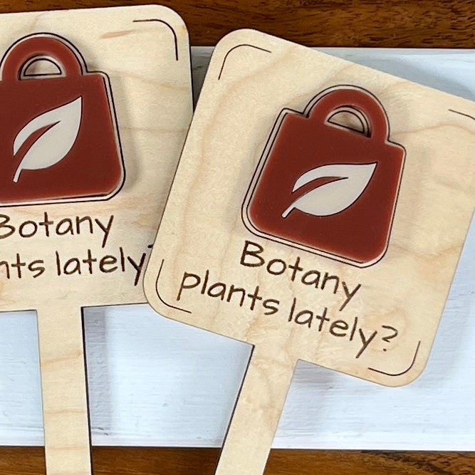 Botany Plants Lately maple plant stakes grouped showing rusty red acrylic shopping bag design
