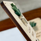 Side view of Lookin' Sharp plant stake showing layered maple wood and green acrylic depth